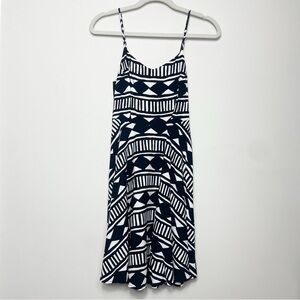 NWT mini dress with black and white print, adjustable straps, size XS